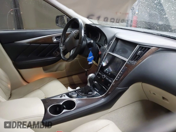 2015 Infiniti Q50 Premium z VIN JN1BV7AP6FM337369, wystawiony jako IAAI lot #41788419 z przebiegiem 106 977 mil mil oraz . Historia ofert i sprzedaży dostępna na DreamBid. Obrazek 5.