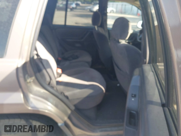 2001 Jeep Grand Cherokee Laredo with VIN 1J4GW48S81C694537, listed as a IAAI auction lot 42447828 with 162,981 mi miles and . Bid and sale history available at DreamBid. Image 8.