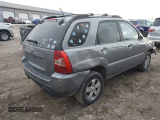 2009 Kia Sportage LX with VIN KNDJF724997570871, listed as a IAAI auction lot 41003267 with 231,654 mi miles and . Bid and sale history available at carsss.com. Image 4.