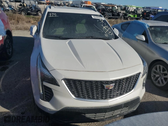 2022 Cadillac XT4 FWD Sport z VIN 1GYFZER44NF118862, wystawiony jako Copart lot #55231775 z przebiegiem 14 983 mil mil oraz Nie do naprawy • Non repairable. Historia ofert i sprzedaży dostępna na DreamBid. Obrazek 5.