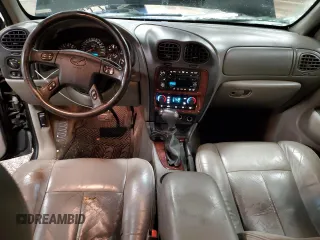 2002 Oldsmobile Bravada z VIN 1GHDT13S522107056, wystawiony jako Copart lot #86296454 z przebiegiem 169 856 mil mil oraz Tytuł czysty. Historia ofert i sprzedaży dostępna na DreamBid. Obrazek 8.