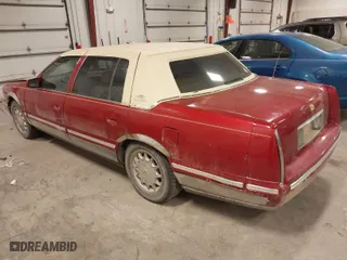 1999 Cadillac DeVille with VIN 1G6KD54Y9XU774473, listed as a IAAI auction lot 41366980 with 140,248 mi miles. Bid and sale history available at carsss.com. Image 3.