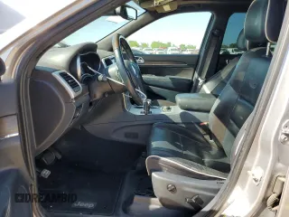2014 Jeep Grand Cherokee Overland with VIN 1C4RJFCG7EC153156, listed as a Copart auction lot 52452925 with 152,348 mi miles and Salvage Title. Bid and sale history available at DreamBid. Image 7.