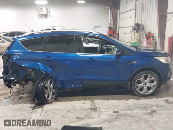 2018 Ford Escape Titanium with VIN 1FMCU9J99JUB94925, listed as a IAAI auction lot 42412800 with 95,880 mi miles and . Bid and sale history available at DreamBid. Image 14.