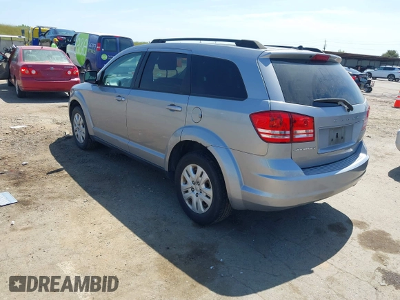 2016 Dodge Journey SE with VIN 3C4PDCAB1GT230387, listed as a IAAI auction lot 42106842 with 157,299 mi miles. Bid and sale history available at carsss.com. Image 3.