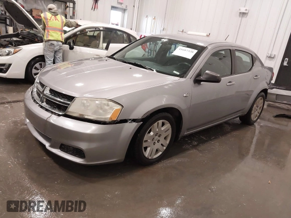 2014 Dodge Avenger SE with VIN 1C3CDZAB4EN148429, listed as a IAAI auction lot 41687320 with 149,084 mi miles and . Bid and sale history available at DreamBid. Image 2.