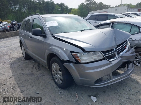 2017 Dodge Journey SE z VIN 3C4PDCAB0HT694918, wystawiony jako IAAI lot #42010594 z przebiegiem 135 432 mil mil oraz . Historia ofert i sprzedaży dostępna na DreamBid. Obrazek 1.