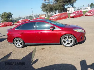 2014 Ford Focus Titanium with VIN 1FADP3J2XEL247827, listed as a IAAI auction lot 41959720 with 105,373 mi miles. Bid and sale history available at carsss.com. Image 13.