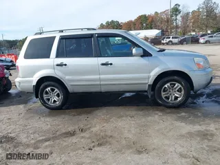 2004 Honda Pilot EX with VIN 2HKYF18634H515163, listed as a IAAI auction lot 40786017 with 206,036 mi miles. Bid and sale history available at carsss.com. Image 13.