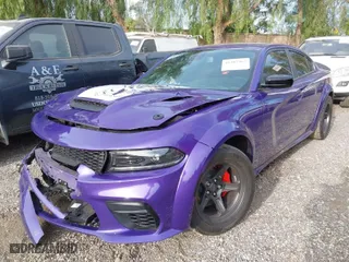 2023 Dodge Charger Scat Pack Widebody with VIN 2C3CDXGJ2PH638480, listed as a IAAI auction lot 41387362 with 8,363 mi miles. Bid and sale history available at carsss.com. Image 2.
