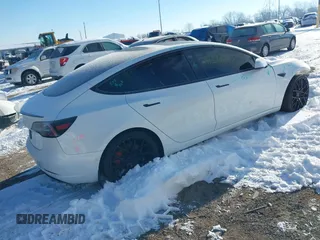 2021 Tesla Model 3 Performance with VIN 5YJ3E1EC1MF063445, listed as a IAAI auction lot 41293243 with 43,143 mi miles and . Bid and sale history available at DreamBid. Image 4.