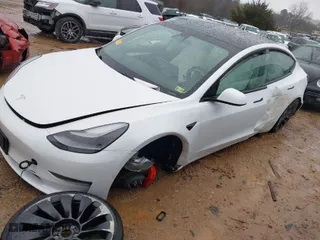 2021 Tesla Model 3 Performance with VIN 5YJ3E1EC3MF995632, listed as a IAAI auction lot 41548478 with 43,585 mi miles. Bid and sale history available at carsss.com. Image 2.