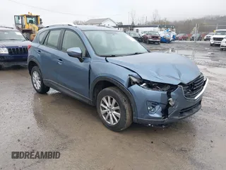 2016 Mazda CX-5 Sport with VIN JM3KE4BY5G0727608, listed as a IAAI auction lot 41975279 with 95,817 mi miles and . Bid and sale history available at carsss.com. Image 1.