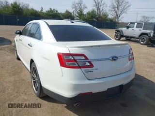 2015 Ford Taurus SEL z VIN 1FAHP2E86FG202386, wystawiony jako IAAI lot #42061925 z przebiegiem 123 475 mil mil oraz . Historia ofert i sprzedaży dostępna na DreamBid. Obrazek 3.