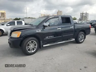 2012 Nissan Titan SL z VIN 1N6BA0ED4CN324476, wystawiony jako Copart lot #57143585 z przebiegiem 101 470 mil mil oraz Szkoda całkowita • Salvage title. Historia ofert i sprzedaży dostępna na DreamBid. Obrazek 1.