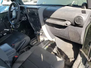 2009 Jeep Wrangler X with VIN 1J4FA24169L707695, listed as a Copart auction lot 49861955 with 89,807 mi miles and Salvage Title. Bid and sale history available at DreamBid. Image 8.