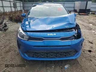 2023 Kia Rio S with VIN 3KPA24AD6PE548027, listed as a Copart auction lot 63697104 with 34,588 mi miles and Salvage Title. Bid and sale history available at carsss.com. Image 5.