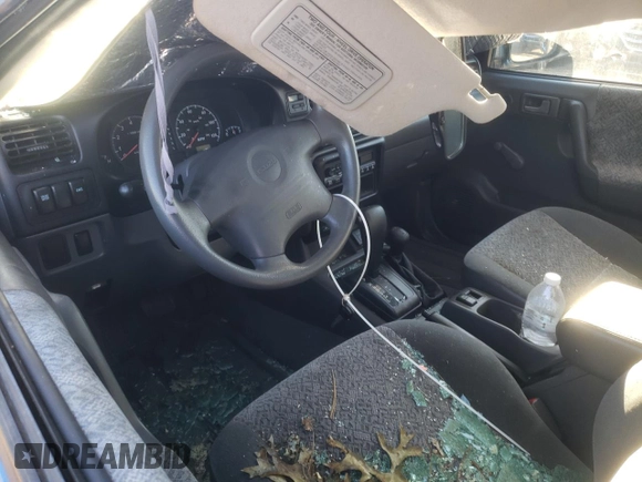 2001 Isuzu Rodeo S with VIN 4S2DM58WX14301336, listed as a Copart auction lot 77770164 with Not provided miles and Salvage title. Bid and sale history available at DreamBid. Image 8.
