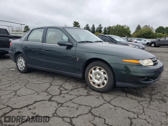 2001 Saturn LS z VIN 1G8JU54F41Y581083, wystawiony jako Copart lot #73123714 z przebiegiem 98 500 mil mil oraz Szkody całkowita. Historia ofert i sprzedaży dostępna na DreamBid. Obrazek 4.