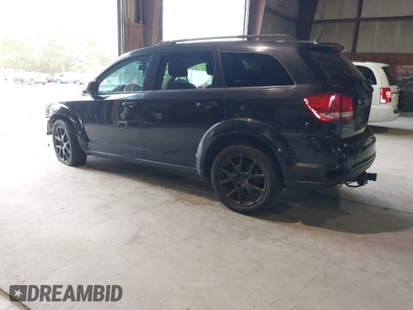2013 Dodge Journey SXT with VIN 3C4PDDBG0DT660956, listed as a IAAI auction lot 41593385 with 196,021 mi miles and . Bid and sale history available at DreamBid. Image 3.