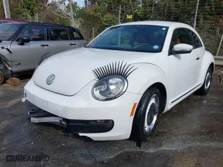 2016 Volkswagen Beetle Coupe 1.8T Wolfsburg Edition with VIN 3VWF17AT4GM636529, listed as a IAAI auction lot 41824038 with 1 mi miles. Bid and sale history available at carsss.com. Image 17.