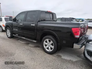 2010 Nissan Titan LE with VIN 1N6BA0EC8AN318538, listed as a Copart auction lot 74122194 with Not Provided miles and Salvage Title. Bid and sale history available at carsss.com. Image 2.