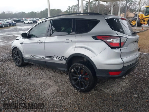 2018 Ford Escape SE z VIN 1FMCU9GD1JUB35184, wystawiony jako IAAI lot #41611285 z przebiegiem 142 267 mil mil oraz . Historia ofert i sprzedaży dostępna na DreamBid. Obrazek 3.
