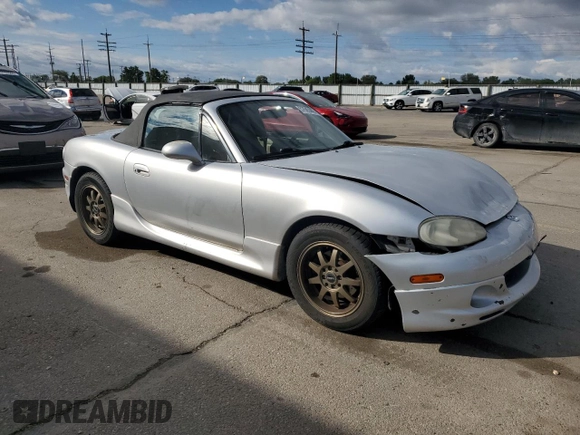 2003 Mazda MX-5 Miata Cloth z VIN JM1NB353X30311086, wystawiony jako Copart lot #57685445 z przebiegiem 141 634 mil mil oraz Szkoda całkowita • Salvage title. Historia ofert i sprzedaży dostępna na DreamBid. Obrazek 4.