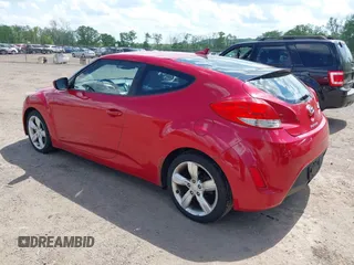 2012 Hyundai Veloster w/Gray Int z VIN KMHTC6AD7CU036446, wystawiony jako IAAI lot #42267057 z przebiegiem 110 564 mil mil oraz . Historia ofert i sprzedaży dostępna na DreamBid. Obrazek 3.
