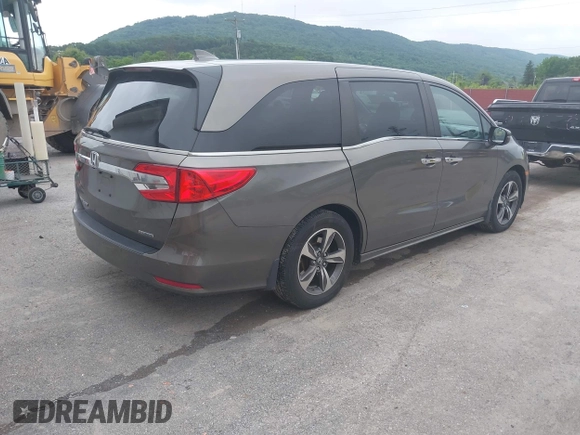 2018 Honda Odyssey Touring with VIN 5FNRL6H89JB057148, listed as a IAAI auction lot 42511909 with 166,438 mi miles and . Bid and sale history available at DreamBid. Image 4.