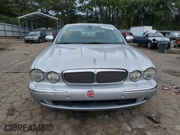 2007 Jaguar XJ with VIN SAJWA71B17SH14626, listed as a Copart auction lot 71013573 with 156,134 mi miles and Salvage Title. Bid and sale history available at carsss.com. Image 5.