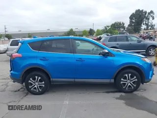 2018 Toyota RAV4 LE with VIN 2T3BFREV6JW740214, listed as a IAAI auction lot 42106349 with 105,831 mi miles and . Bid and sale history available at carsss.com. Image 14.