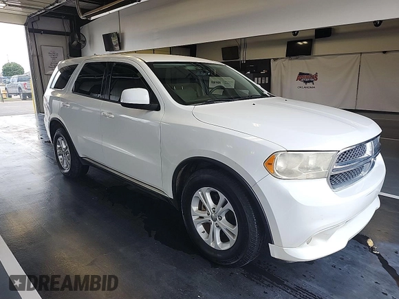 2013 Dodge Durango SXT with VIN 1C4RDJAG8DC671689, listed as a IAAI auction lot 42743958 with 160,950 mi miles and . Bid and sale history available at DreamBid. Image 14.