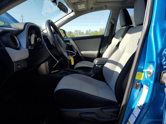 2016 Toyota RAV4 Hybrid XLE with VIN JTMRJREV4GD003211, listed as a Copart auction lot 52111305 with 79,404 mi miles and Salvage Title. Bid and sale history available at carsss.com. Image 7.