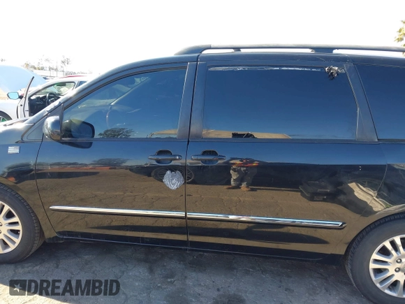 2009 Toyota Sienna XLE with VIN 5TDZK22C69S273555, listed as a IAAI auction lot 41276221 with 129,160 mi miles and . Bid and sale history available at DreamBid. Image 14.