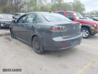 2010 Mitsubishi Lancer DE with VIN JA32U1FU7AU005962, listed as a IAAI auction lot 41927652 with 218,829 mi miles. Bid and sale history available at carsss.com. Image 3.