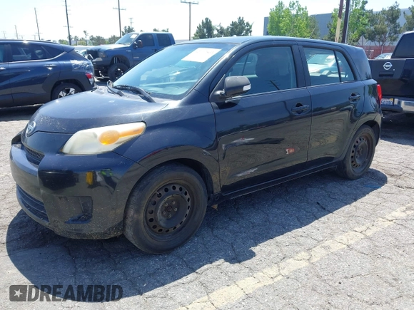 2008 Scion xD with VIN JTKKU10438J014799, listed as a IAAI auction lot 42107563 with 215,136 mi miles. Bid and sale history available at carsss.com. Image 2.
