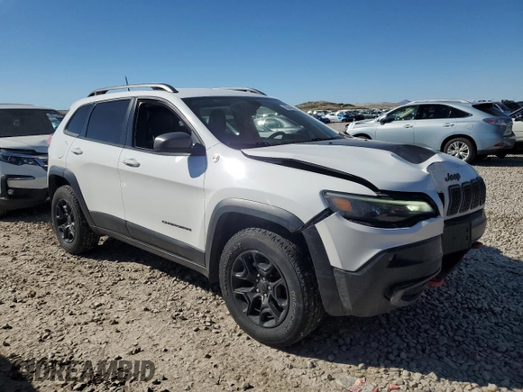 2019 Jeep Cherokee Trailhawk with VIN 1C4PJMBX7KD336494, listed as a Copart auction lot 50346545 with 69,994 mi miles and Salvage Title. Bid and sale history available at DreamBid. Image 4.