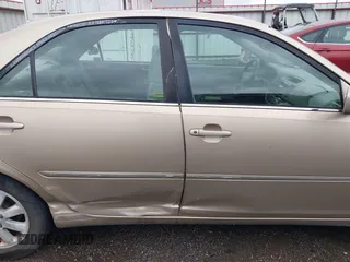 2002 Toyota Camry LE z VIN 4T1BE32K52U086150, wystawiony jako IAAI lot #42126685 z przebiegiem 175 212 mil mil oraz . Historia ofert i sprzedaży dostępna na DreamBid. Obrazek 13.