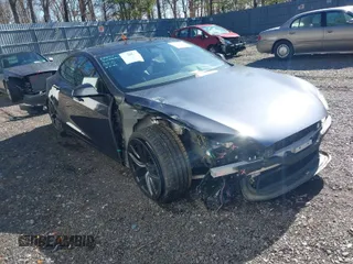 2021 Tesla Model S Long Range with VIN 5YJSA1E52MF428370, listed as a IAAI auction lot 41809773 with 34,372 mi miles and . Bid and sale history available at DreamBid. Image 1.