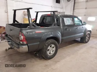 2014 Toyota Tacoma with VIN 3TMLU4EN3EM151917, listed as a IAAI auction lot 41769083 with 216,910 mi miles. Bid and sale history available at carsss.com. Image 4.