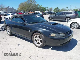 2004 Ford Mustang GT Deluxe z VIN 1FAFP45X64F205026, wystawiony jako IAAI lot #41751116 z przebiegiem 103 564 mil mil oraz . Historia ofert i sprzedaży dostępna na DreamBid. Obrazek 1.