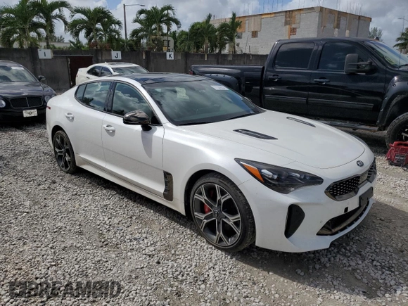 2021 Kia Stinger GT1 with VIN KNAE45LC9M6090262, listed as a Copart auction lot 77339854 with 3,354 mi miles and Salvage Title. Bid and sale history available at carsss.com. Image 4.