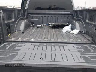 2023 Ford F-150 Lightning Pro with VIN 1FTVW1EL8PWG48559, listed as a IAAI auction lot 42033123 with 8,845 mi miles and . Bid and sale history available at DreamBid. Image 20.