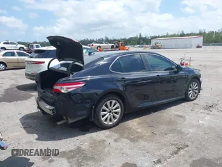 2020 Toyota Camry LE with VIN 4T1C11AK1LU986972, listed as a IAAI auction lot 41966639 with 97,617 mi miles and . Bid and sale history available at carsss.com. Image 4.