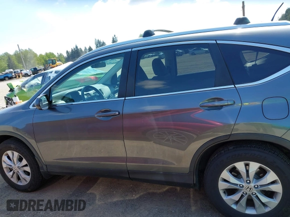 2014 Honda CR-V EX-L with VIN 5J6RM4H79EL077096, listed as a IAAI auction lot 42153513 with 104,972 mi miles and . Bid and sale history available at DreamBid. Image 14.