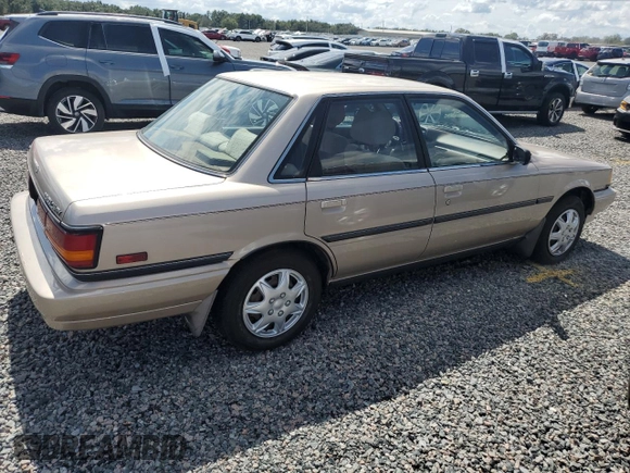 1991 Toyota Camry DLX z VIN 4T1SV21E5MU415356, wystawiony jako Copart lot #74465914 z przebiegiem 74 592 mil mil oraz Szkoda całkowita • Salvage title. Historia ofert i sprzedaży dostępna na DreamBid. Obrazek 3.