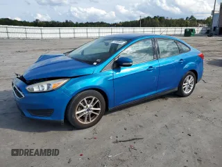 2016 Ford Focus SE with VIN 1FADP3F22GL201050, listed as a Copart auction lot 71358464 with 94,471 mi miles and Salvage title. Bid and sale history available at DreamBid. Image 1.