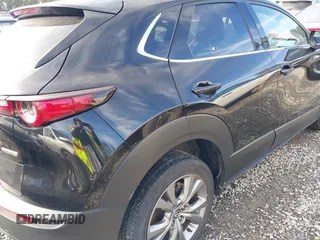 2023 Mazda CX-30 S Premium with VIN 3MVDMBDM7PM528297, listed as a IAAI auction lot 41637542 with 48,935 mi miles and . Bid and sale history available at DreamBid. Image 6.