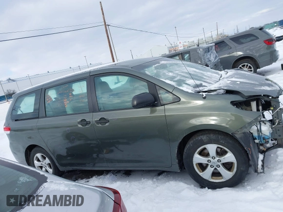 2014 Toyota Sienna L with VIN 5TDZK3DC2ES429684, listed as a IAAI auction lot 41529309 with 112,190 mi miles. Bid and sale history available at carsss.com. Image 13.